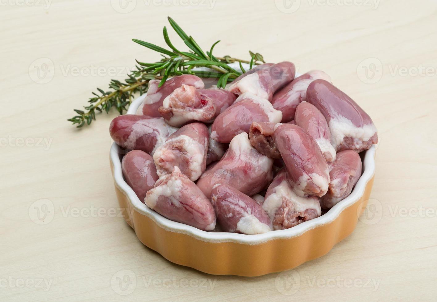Raw chicken hearts photo