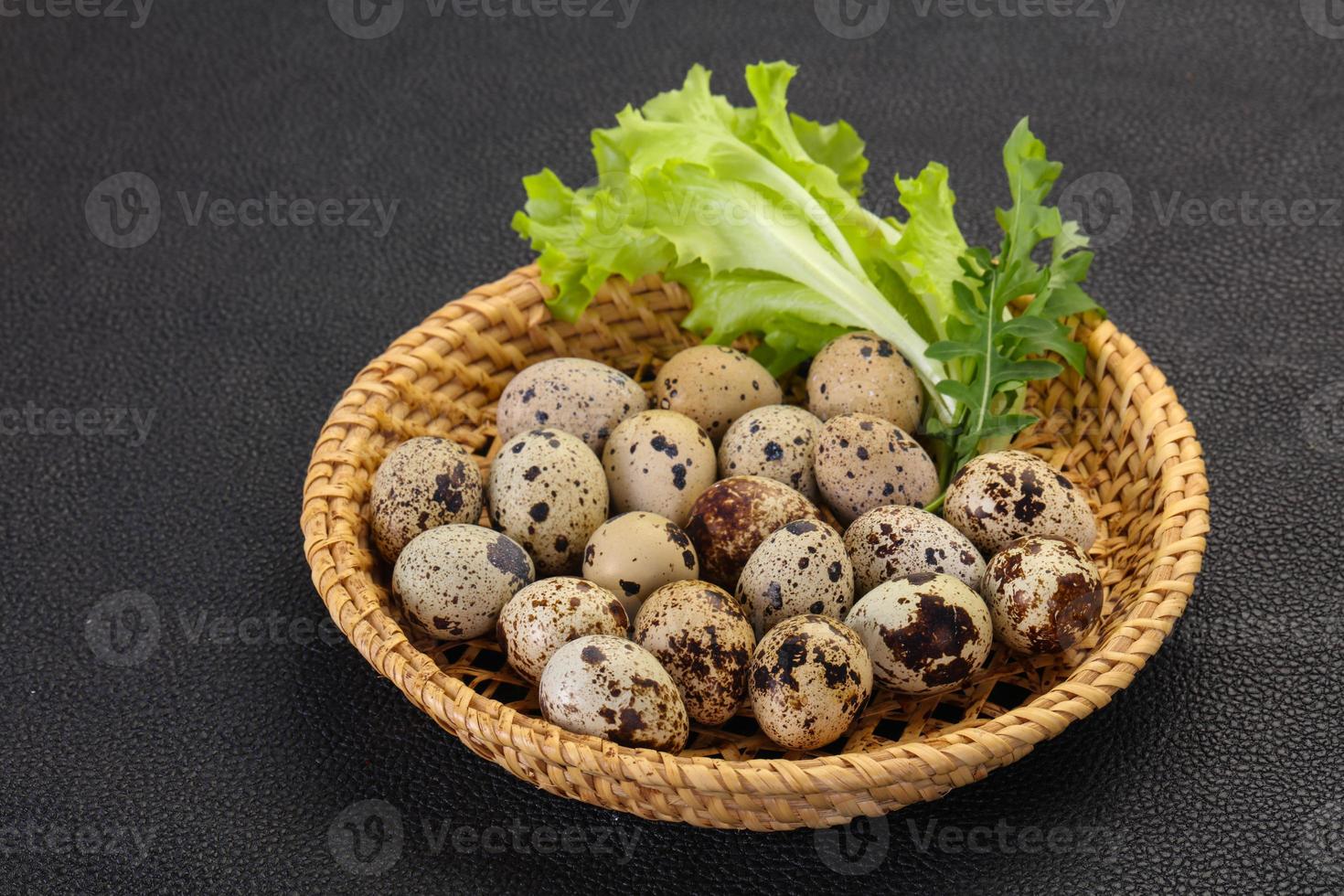 Quail eggs in the basket photo