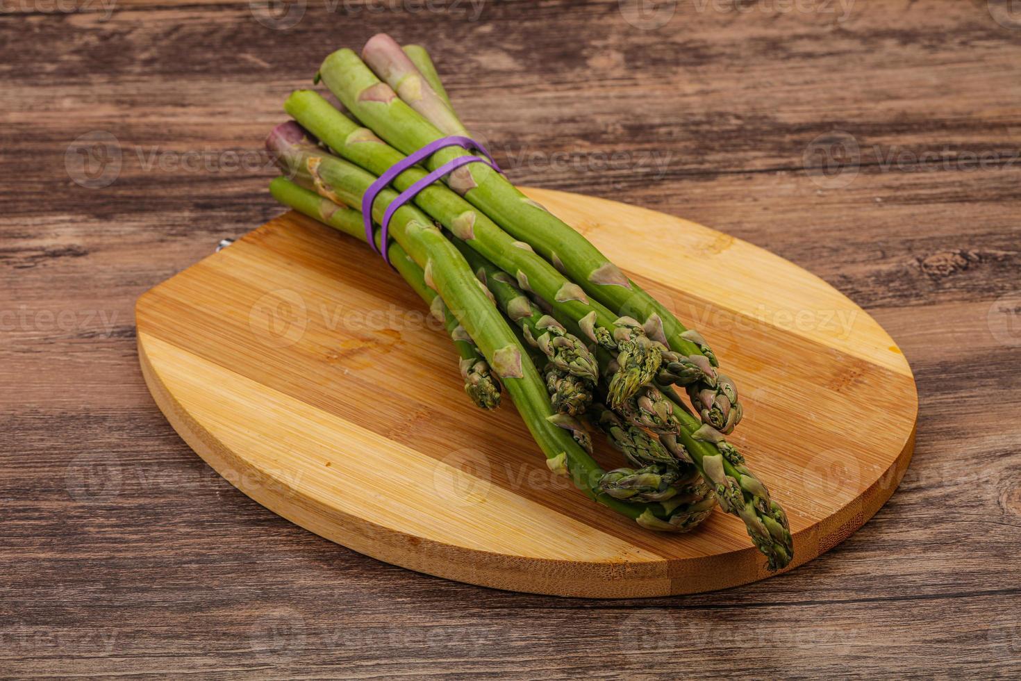 Vegan cuisine - Raw asparagus heap photo