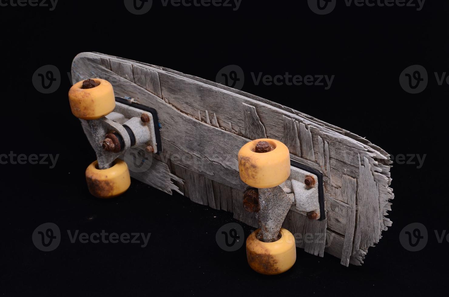 Old Used Wooden Skateboard photo