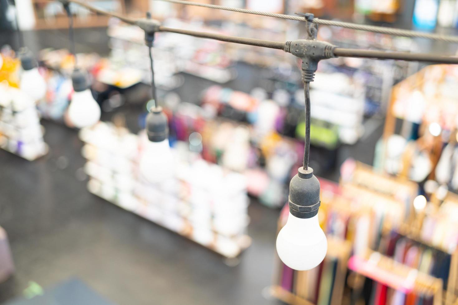 Decorative outdoor string lights hanging on electricity post in the market photo