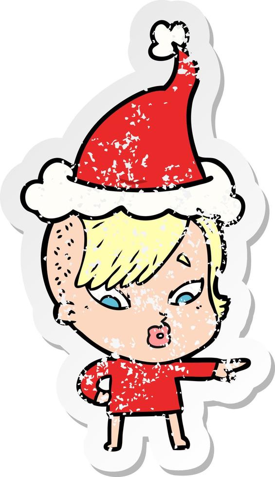 distressed sticker cartoon of a surprised girl pointing wearing santa hat vector