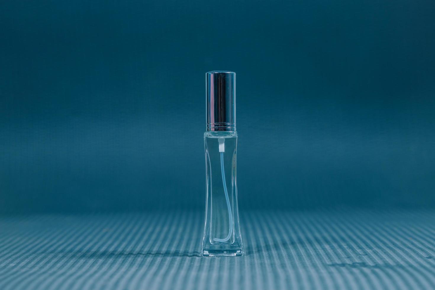 Beautiful bottle of summer perfume in nature. Sea and nature. Fragrance lover. Travel and experience. Perfumer. Copy and design space. photo