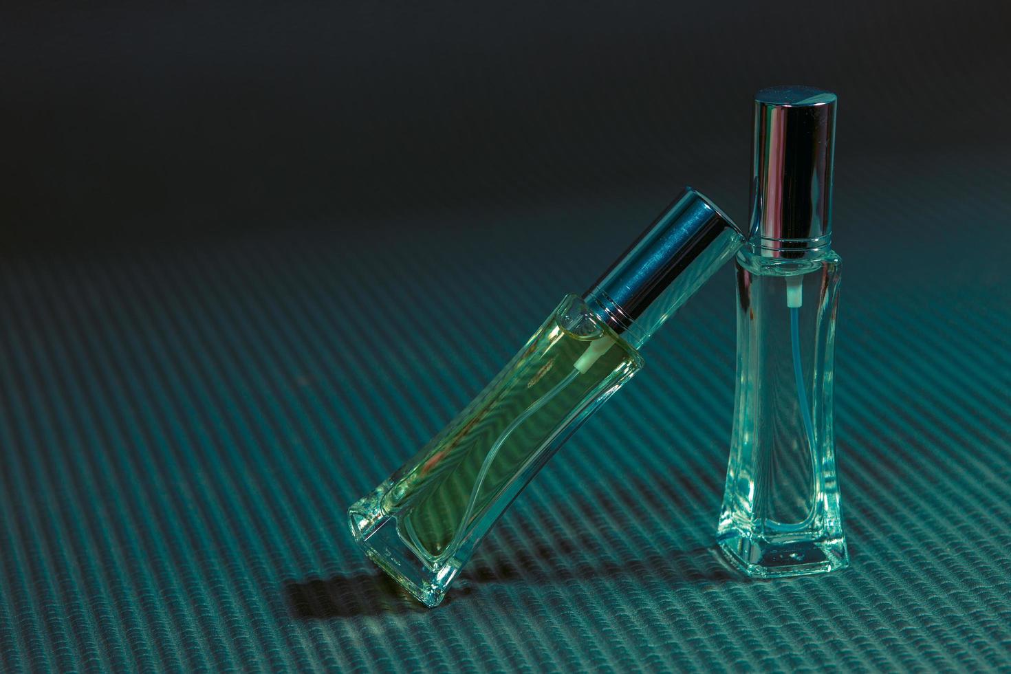 Perfume bottle on the table, black background photo