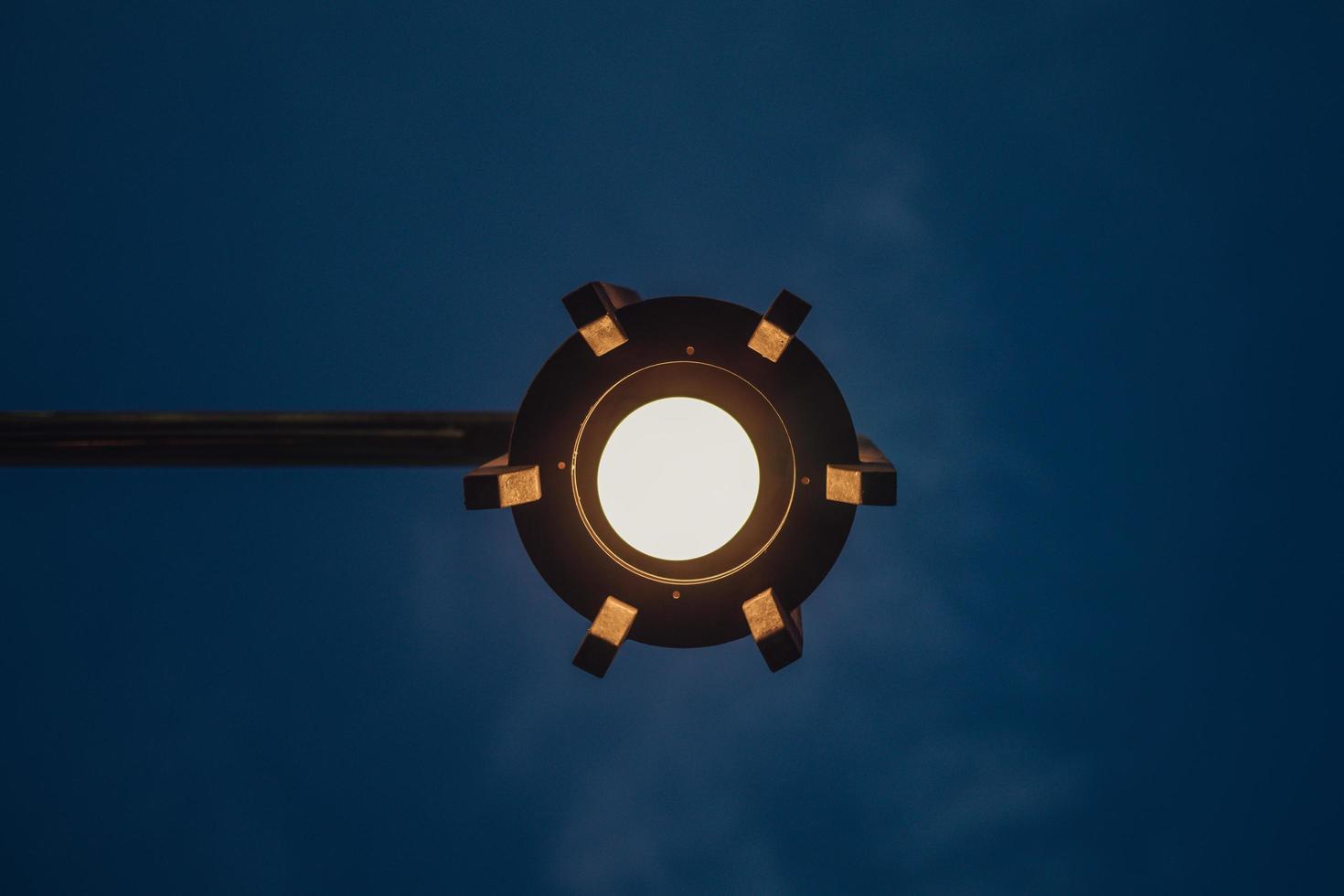 low angle lamp that glows in the evening photo