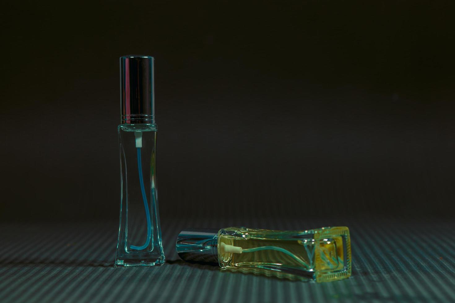 Perfume bottle on the table, black background photo