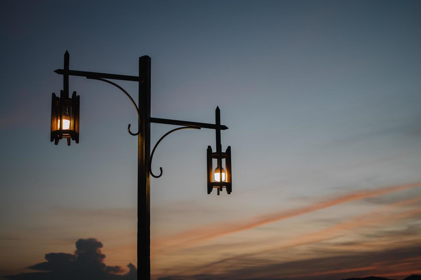 vintage old lamp at dusk, Sunset lamp, blue sky photo