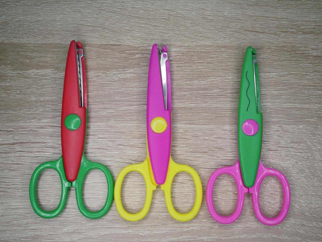 Children's wavy-patterned paper scissors to use in various inventions. photo