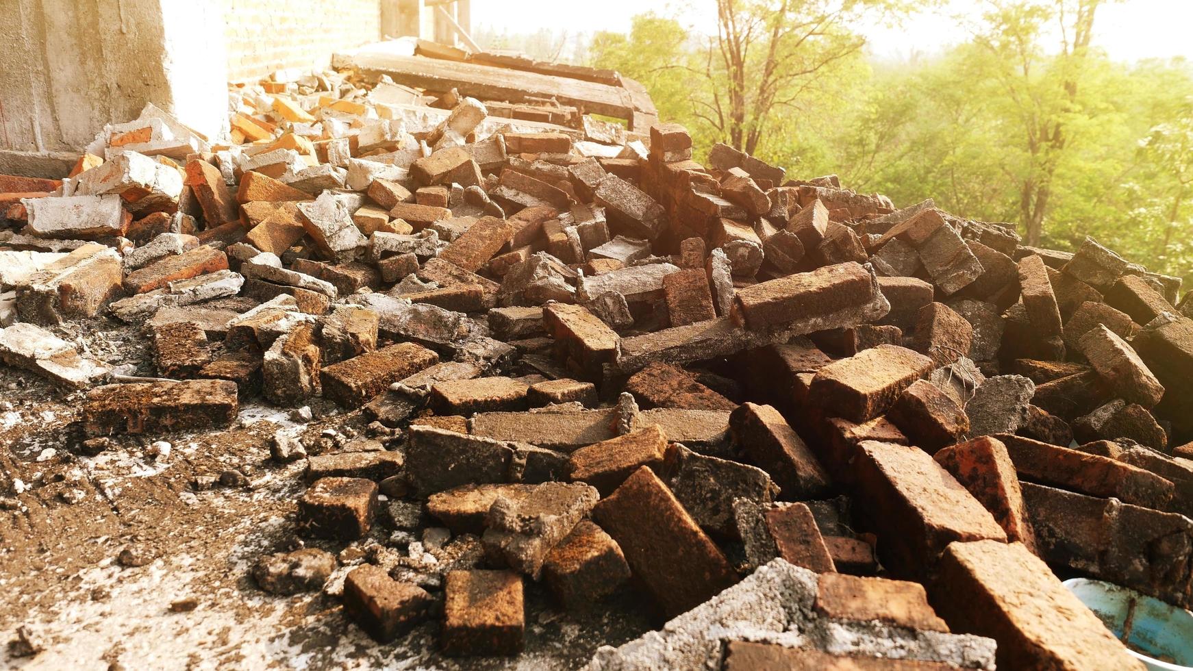 Close-up of the rubble of an industrial building collapsing into a pile of concrete and brick. and the jagged debris caused by the failure of the engineers at the abandoned construction. photo