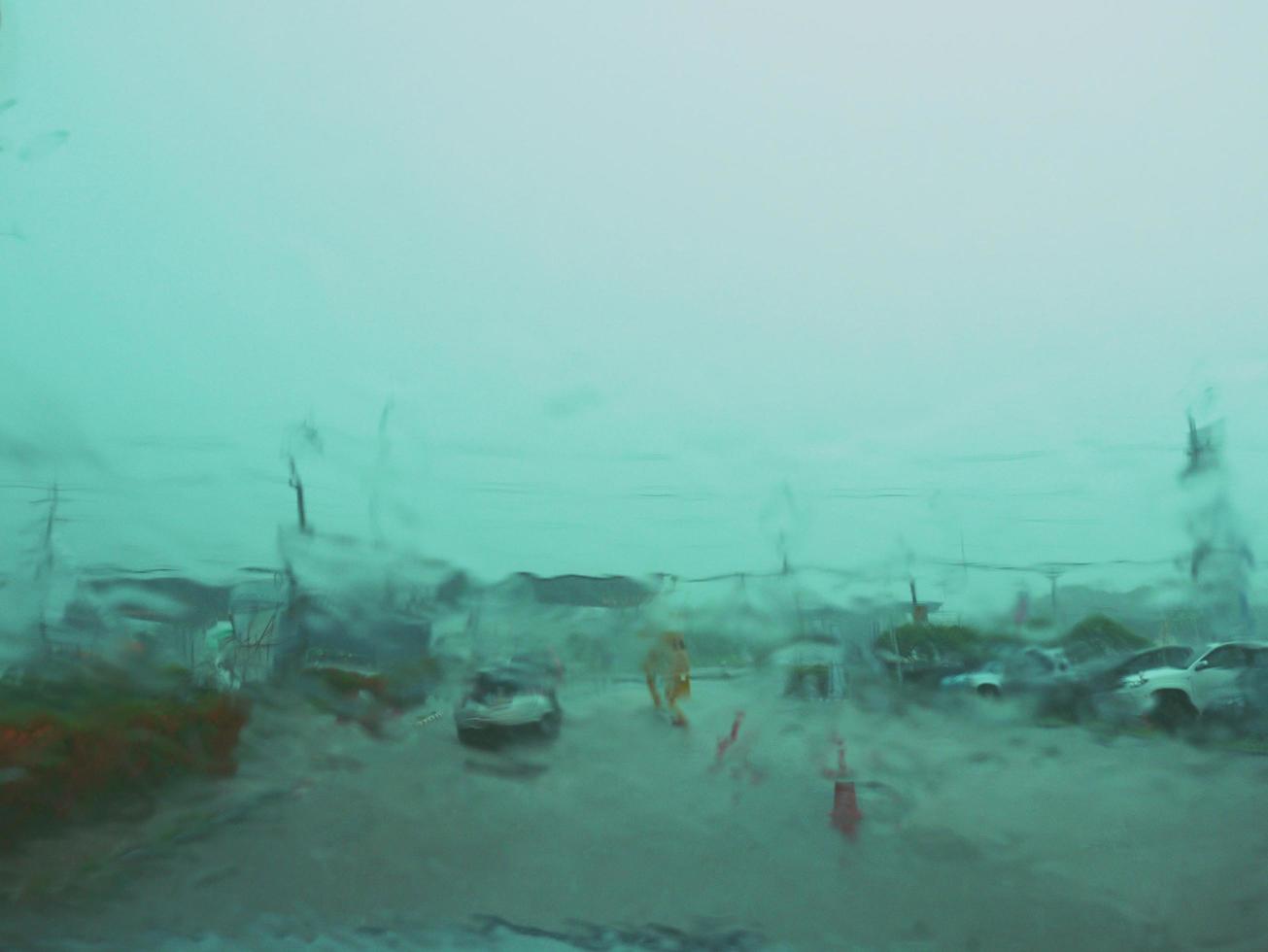 Blurred image in front of car windshield when it rains photo