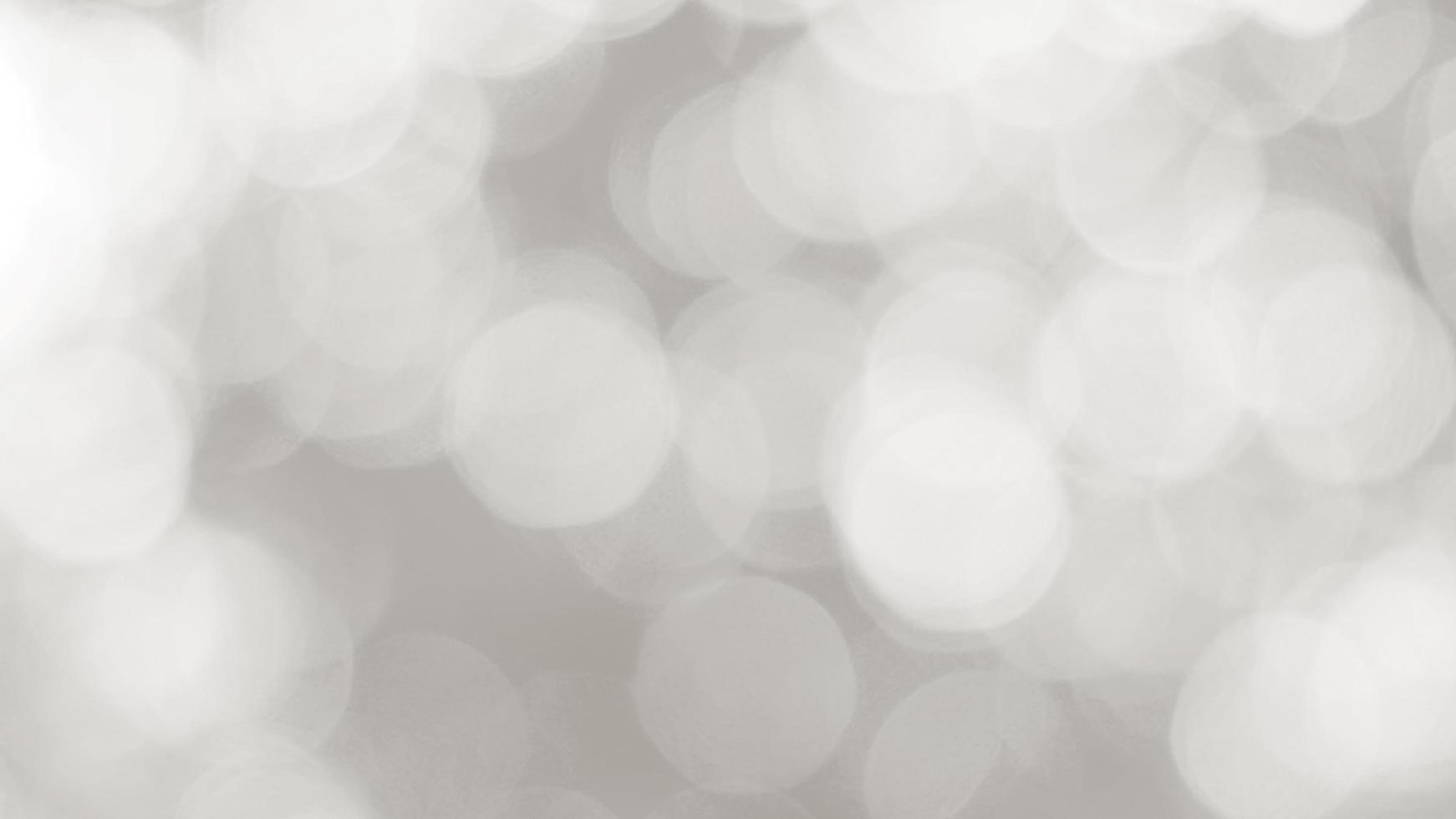 The illuminated white bokeh image can be used as a background illustration or add text. photo