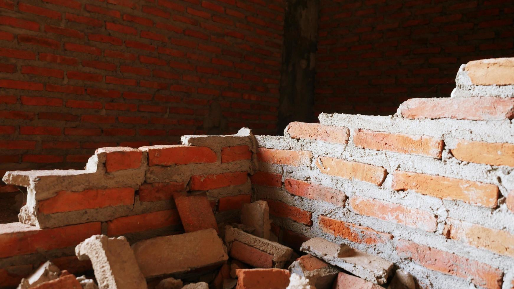 Unconventional building site The masonry was neglected, irresponsible, not progressing, only half finished. Some parts, the walls had rough surfaces. photo