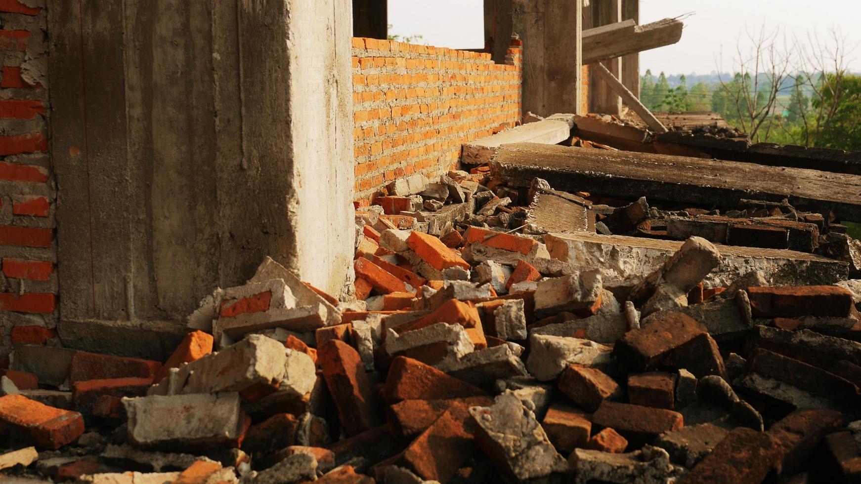 Close-up of the rubble of an industrial building collapsing into a pile of concrete and brick. and the jagged debris caused by the failure of the engineers at the abandoned construction. photo