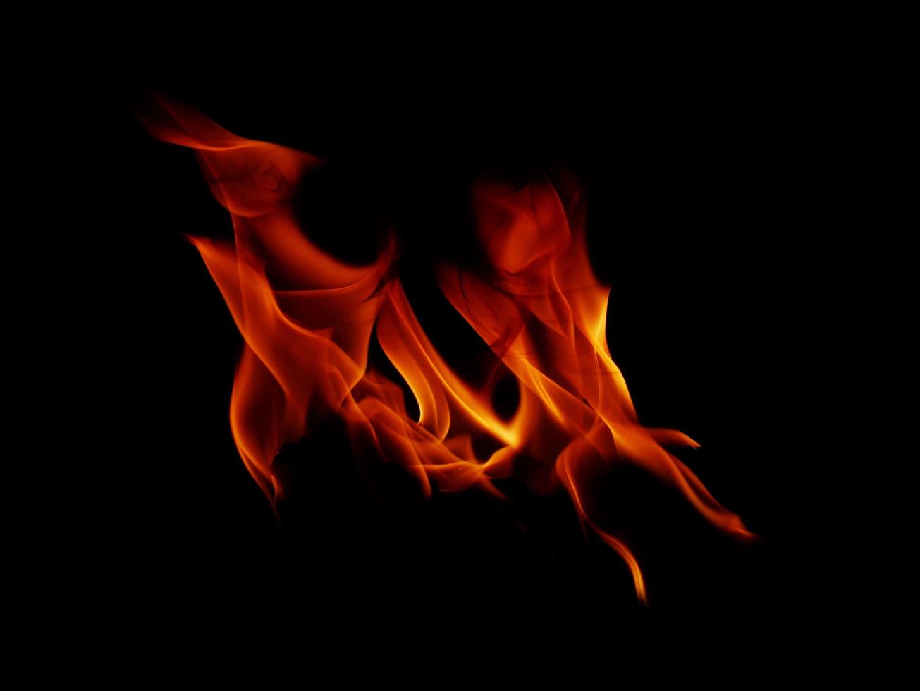 Flame Flame Texture For Strange Shape Fire Background Flame meat that is burned from the stove or from cooking. danger feeling abstract black background Suitable for banners or advertisements. photo