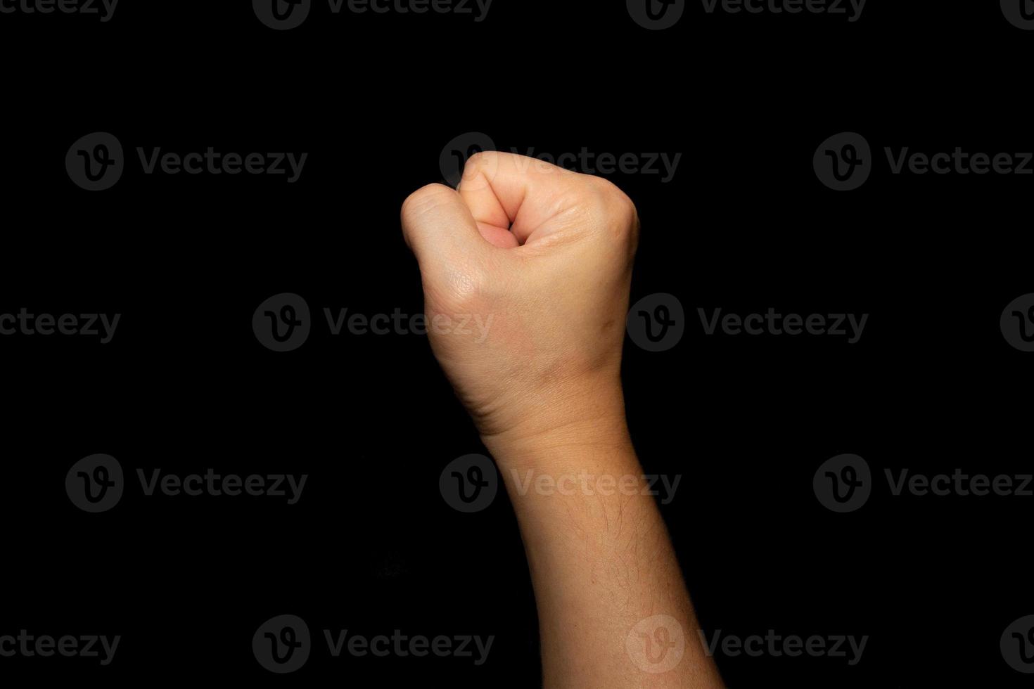 The fists of the right hand show signs of strength or zero. photo