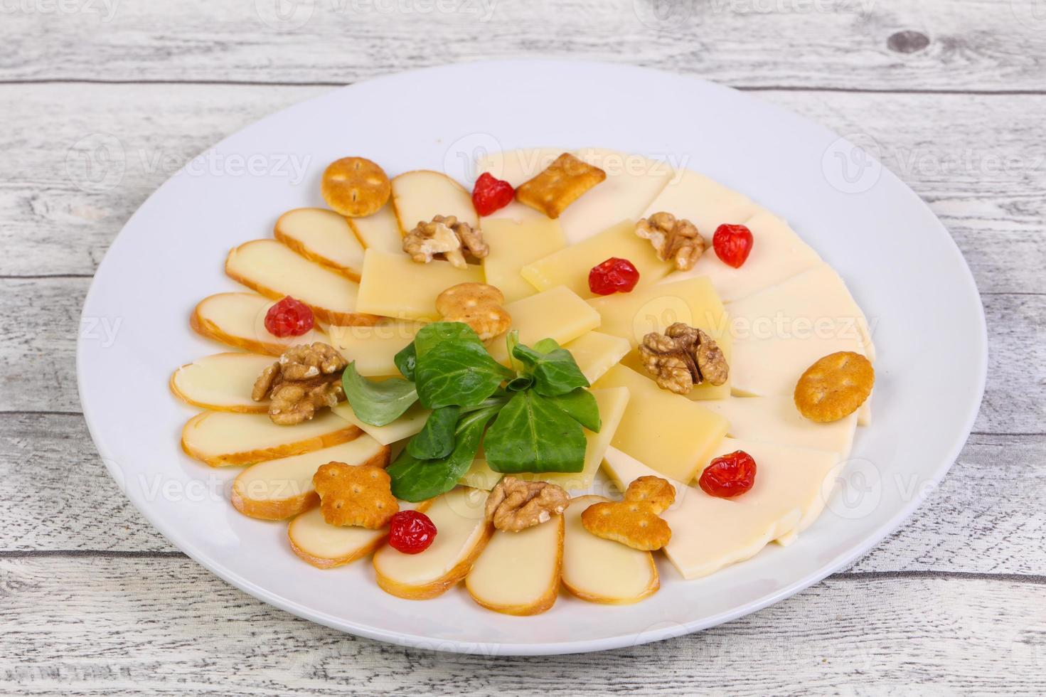 Cheese plate with nuts photo