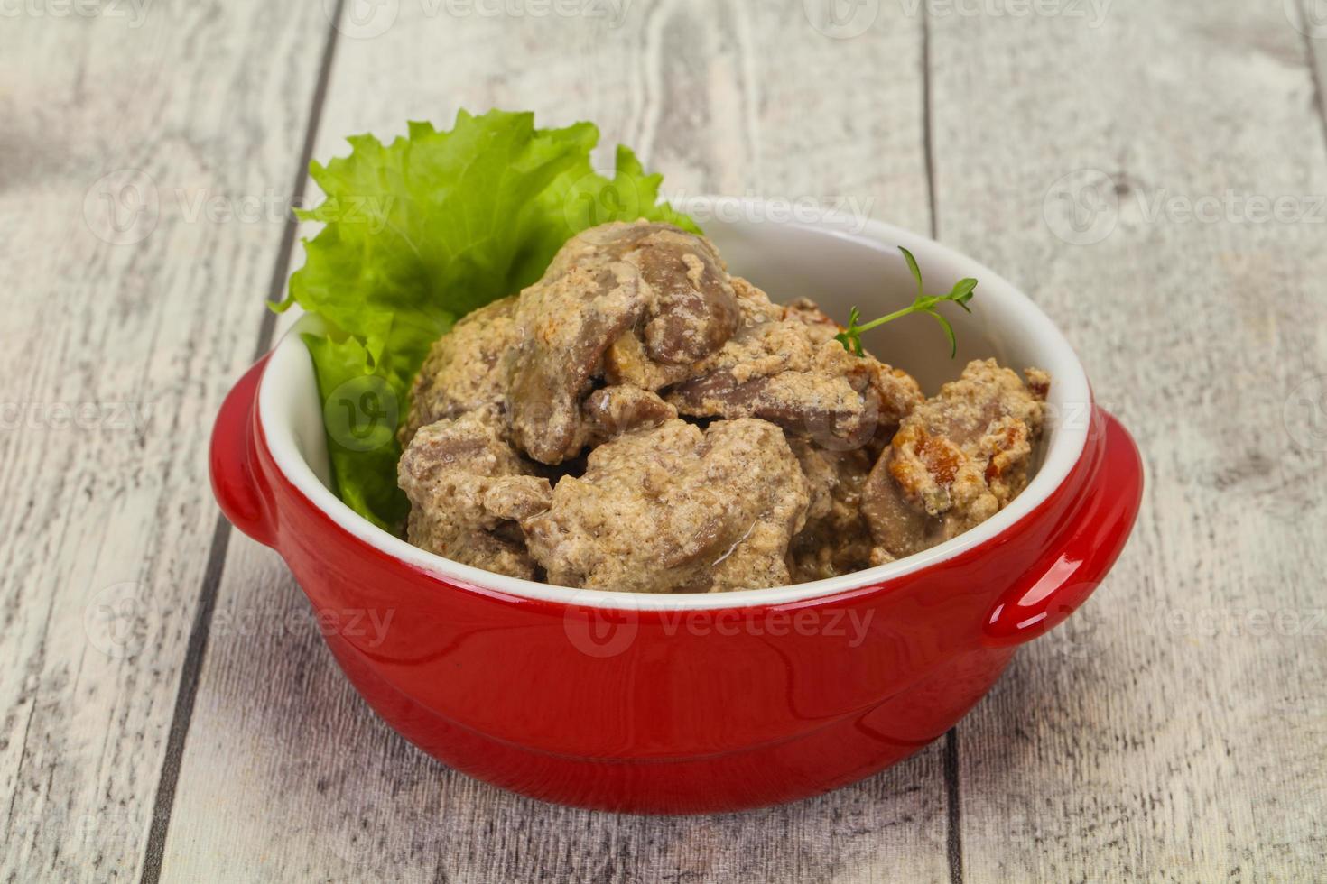 Chicken liver with cream and dry tomatoes photo