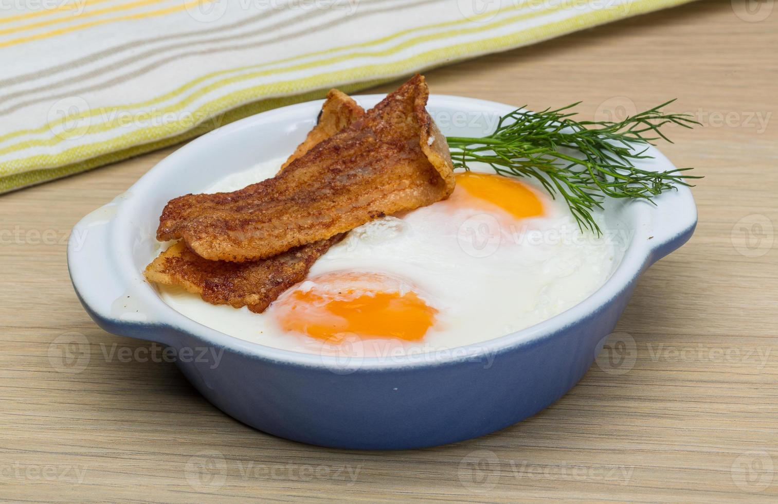 Eggs with grilled bacon photo