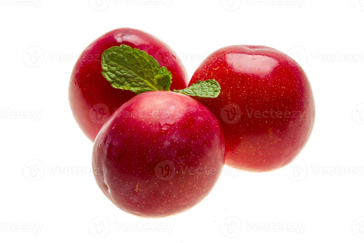 Bright ripe plum with mint photo