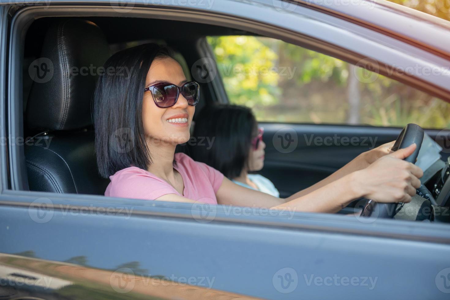 Asian mother and daughter travel holiday long weekend with car. photo