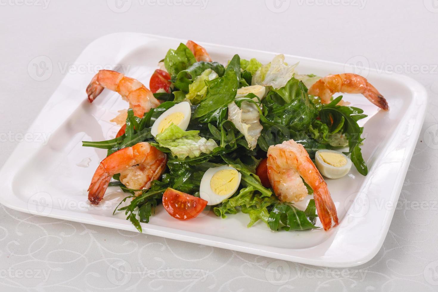 Salad with prawn, rocket and eggs photo