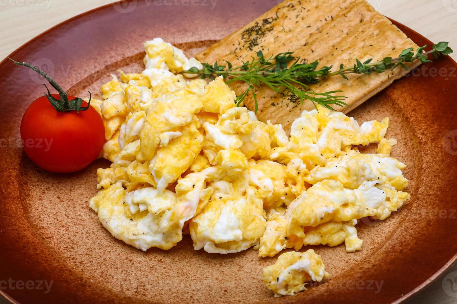 Scrambled eggs with tomato photo