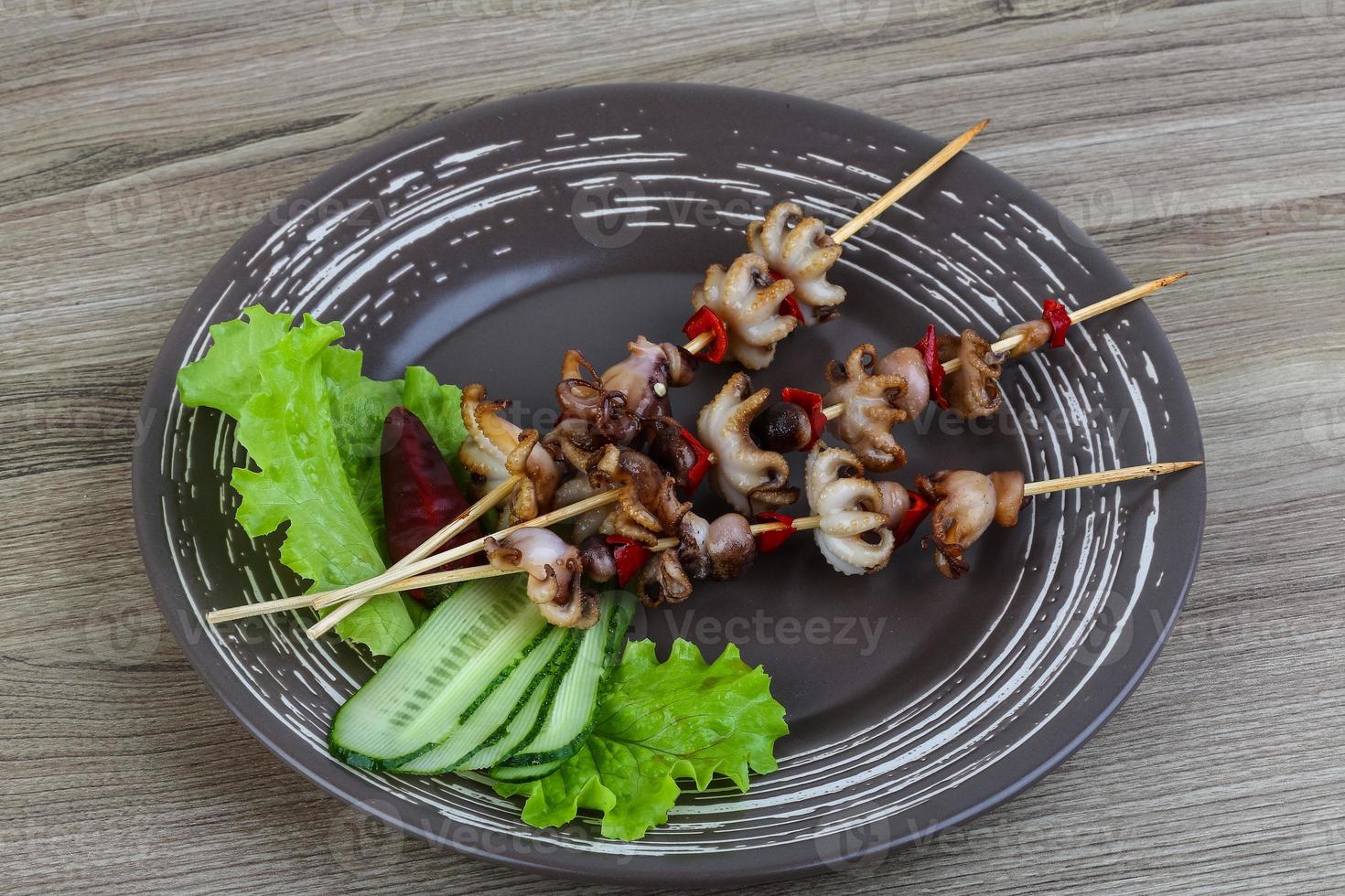 Baby octopus bbq 8498634 Stock Photo at Vecteezy