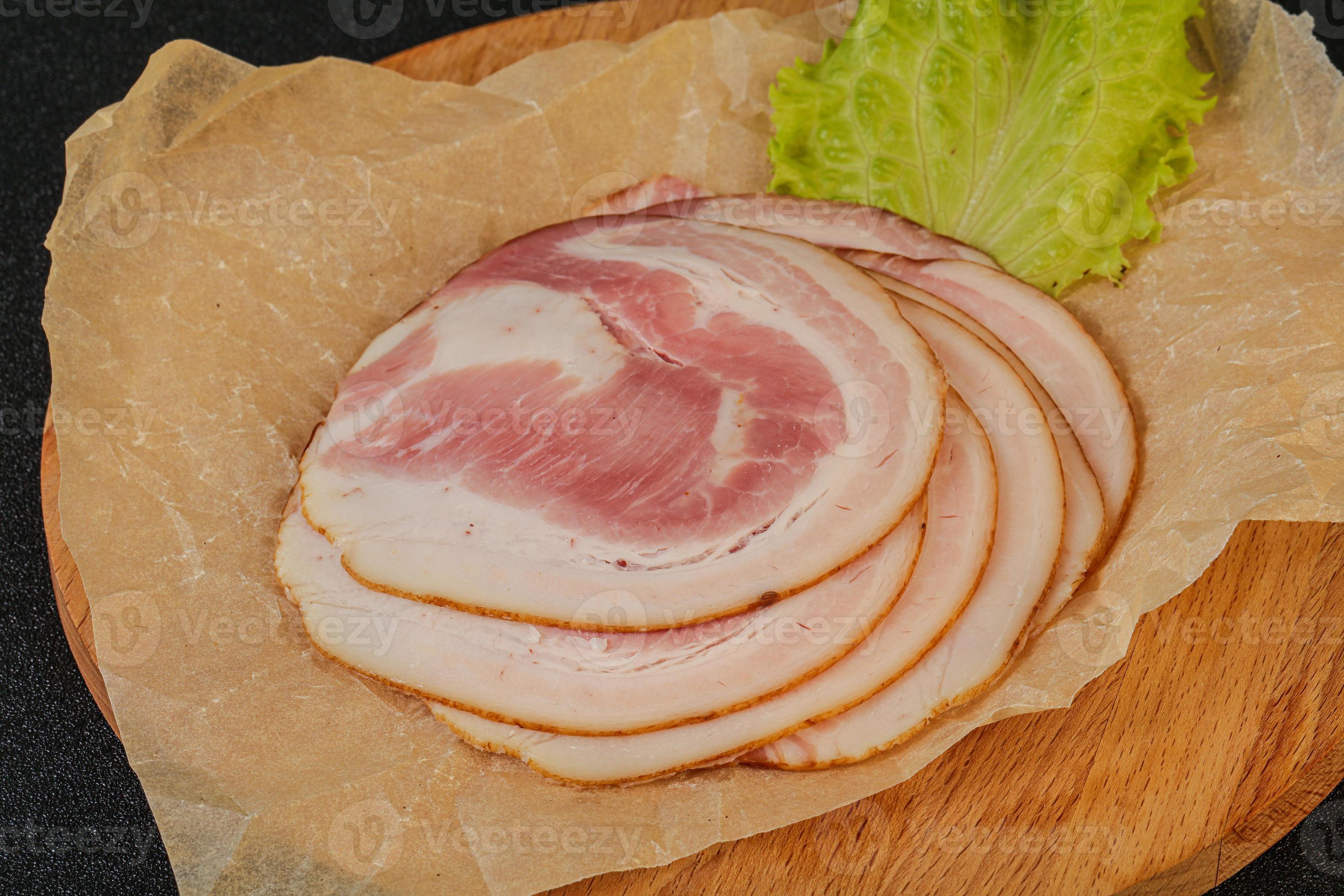 Sliced Pancetta sausage over board 8499017 Stock Photo at Vecteezy