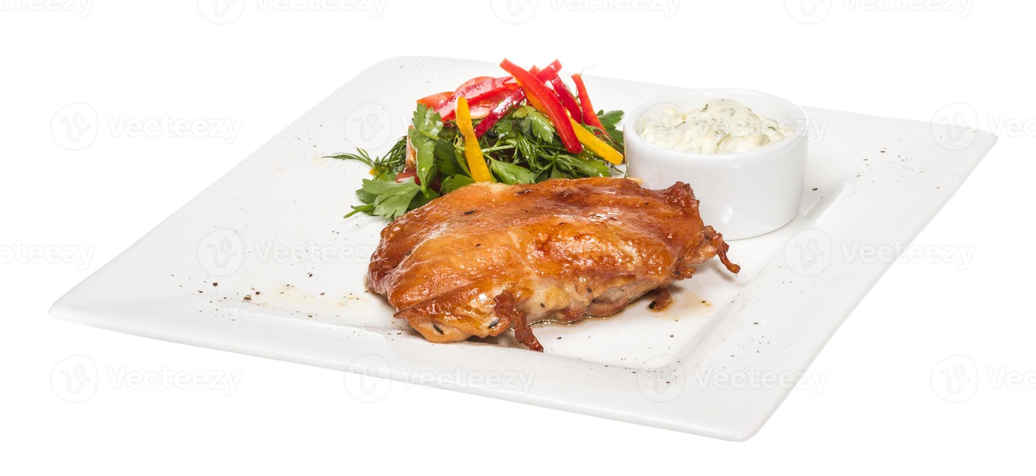 roasted chicken with vegetables on a white plate photo