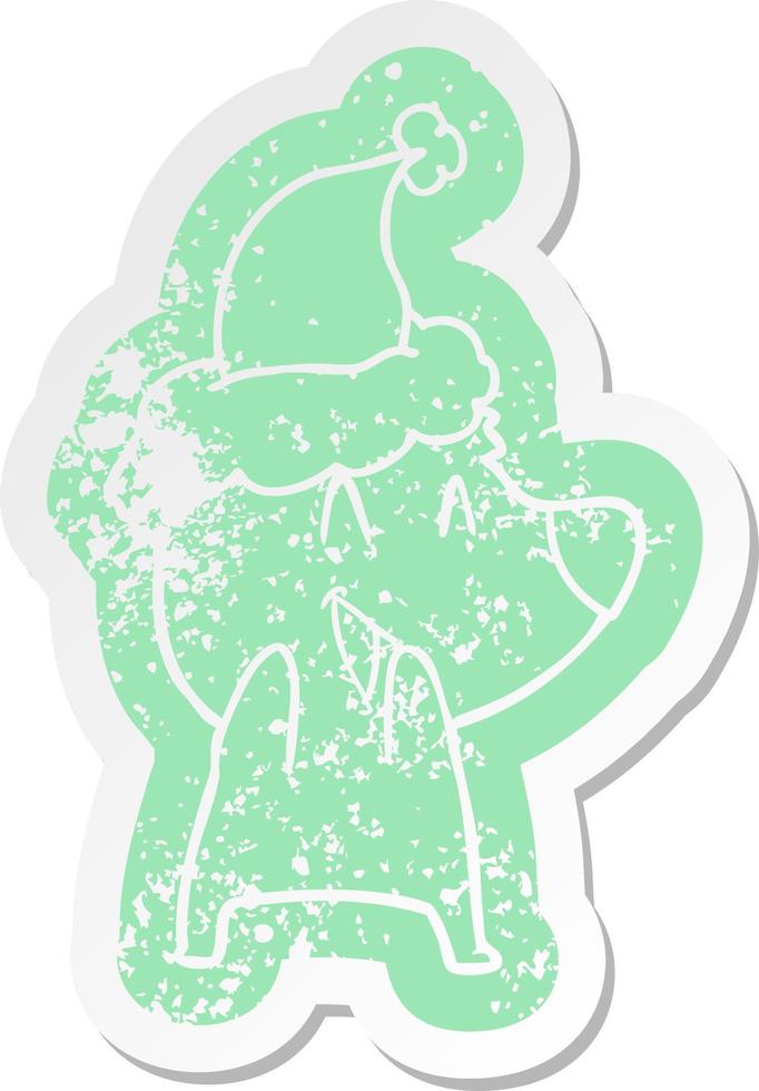 laughing polar bear cartoon distressed sticker of a wearing santa hat vector