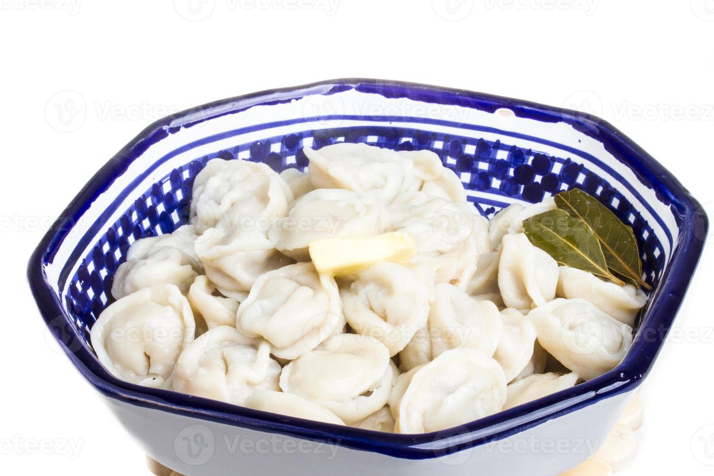 Bowl with traditional russian dish - pelmeni photo