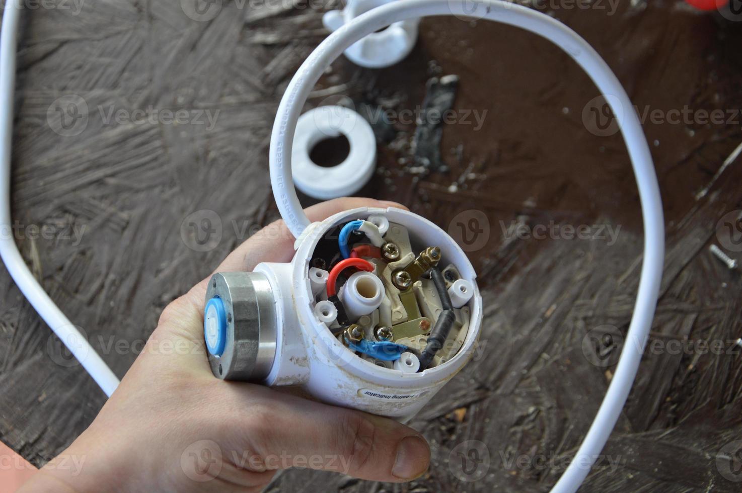 Repair of the flowing tap of the water heater in the kitchen photo