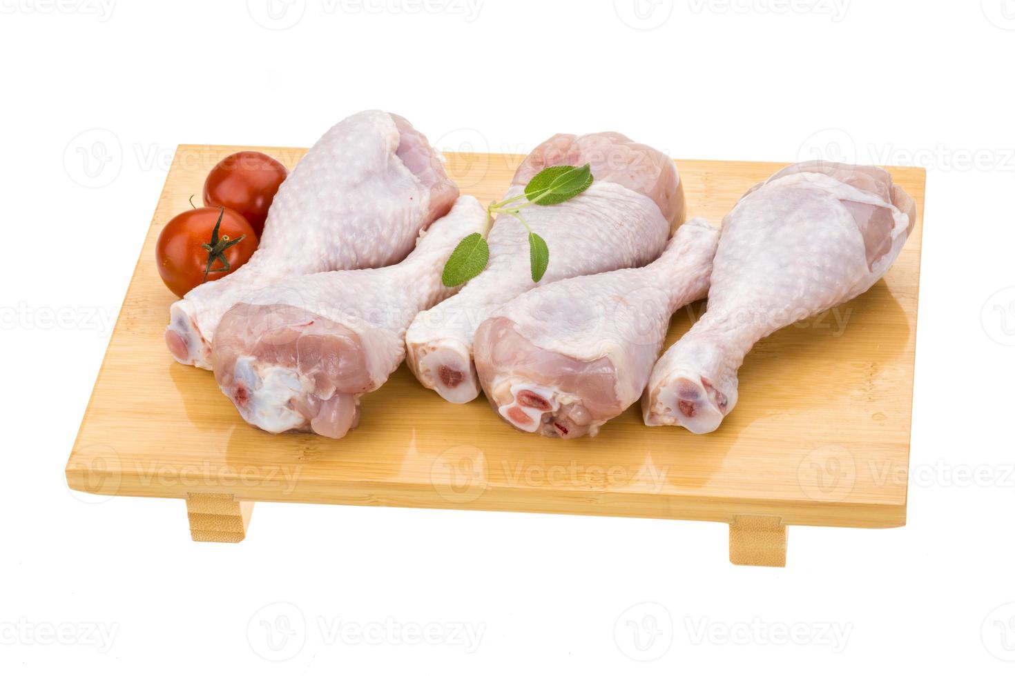 Raw chicken legs photo