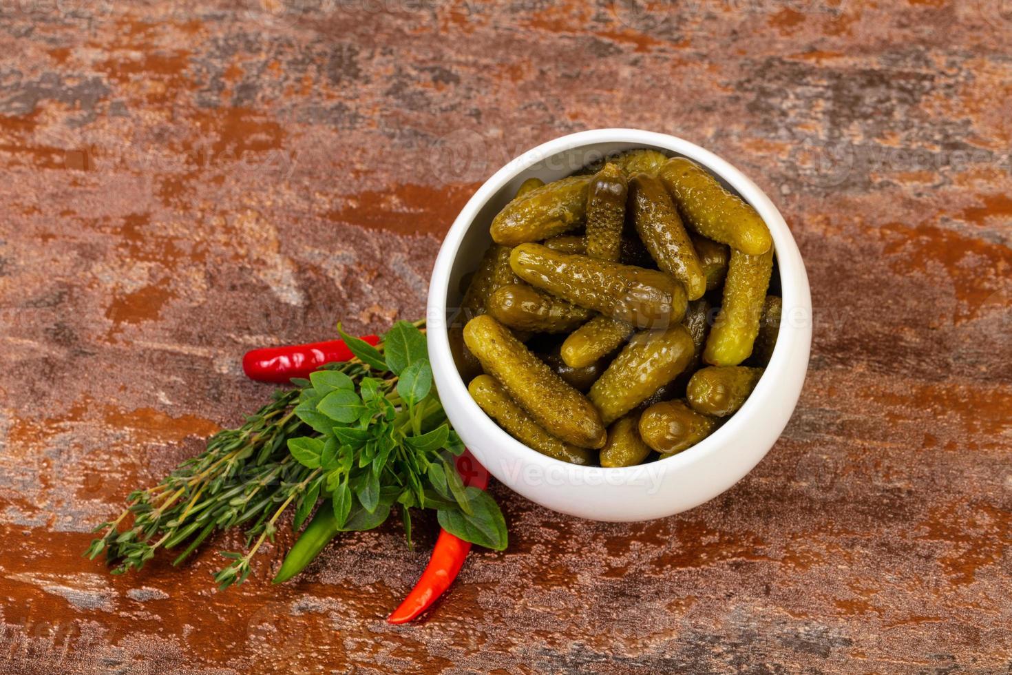 Pickled small cucumbers photo