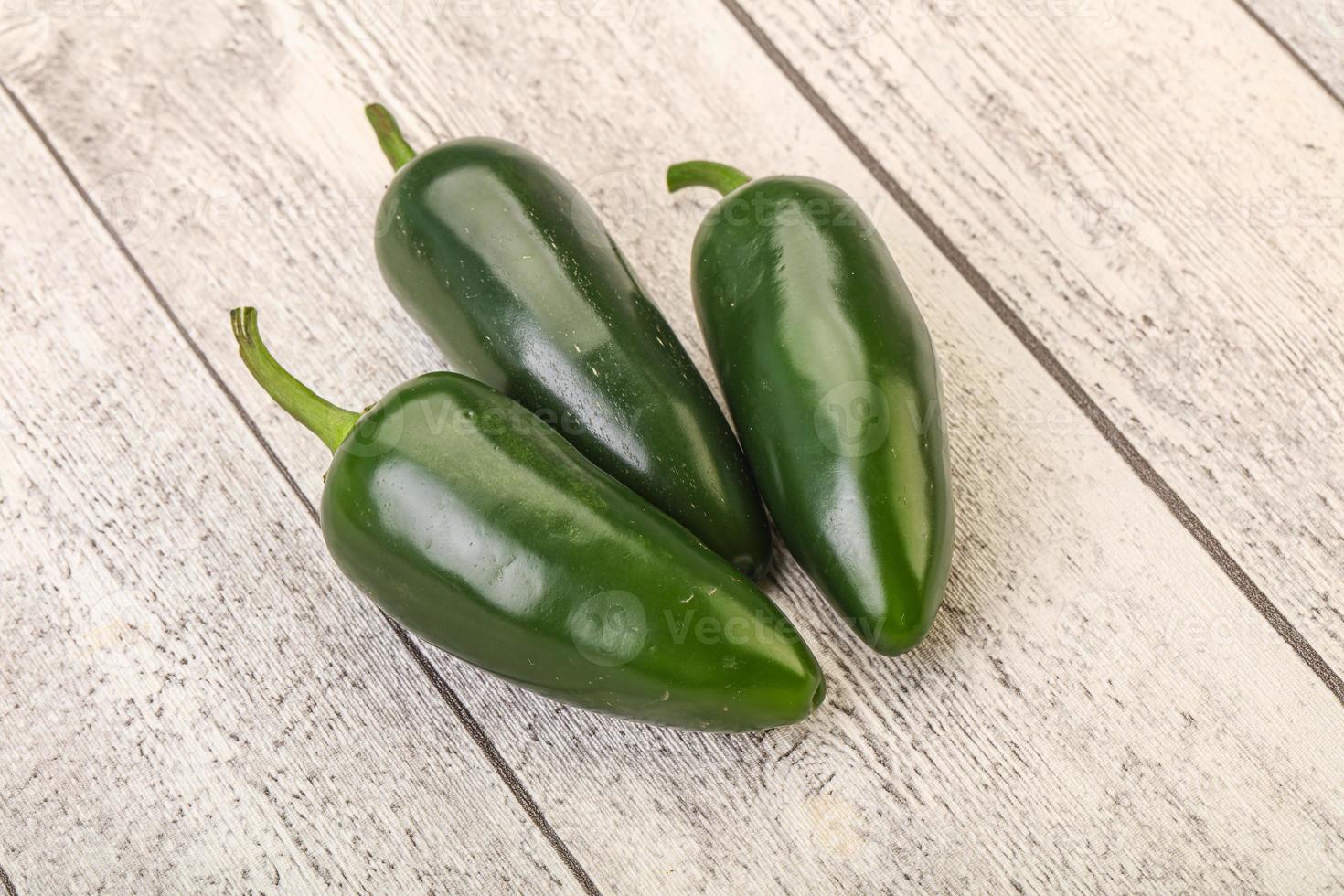 Green raw jalapeno peper heap photo