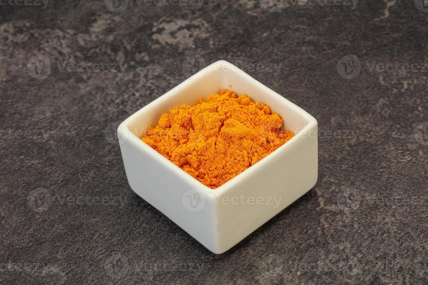 Tumeric powder in the bowl photo