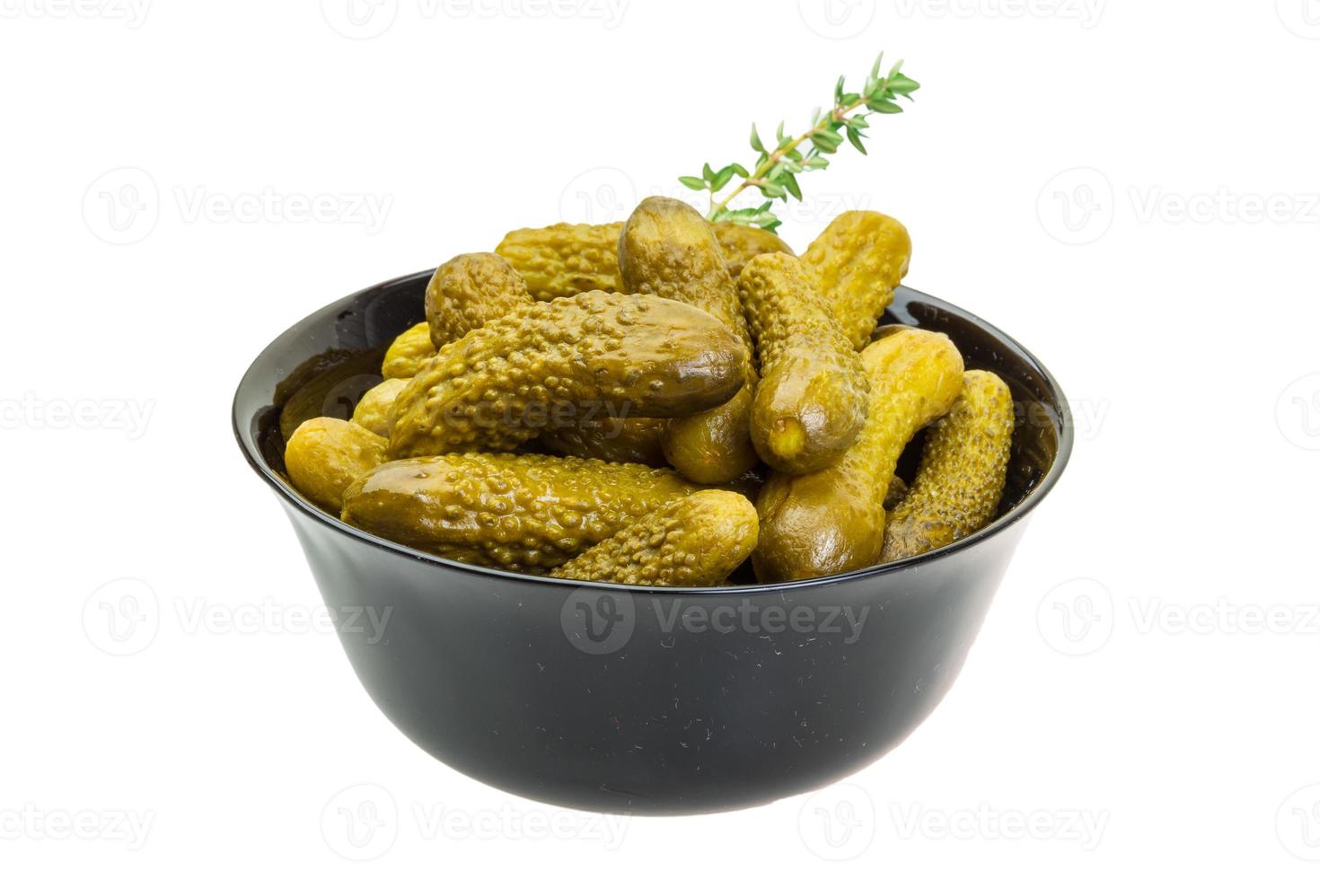 Marinated cucumbers, pickles in a bowl photo