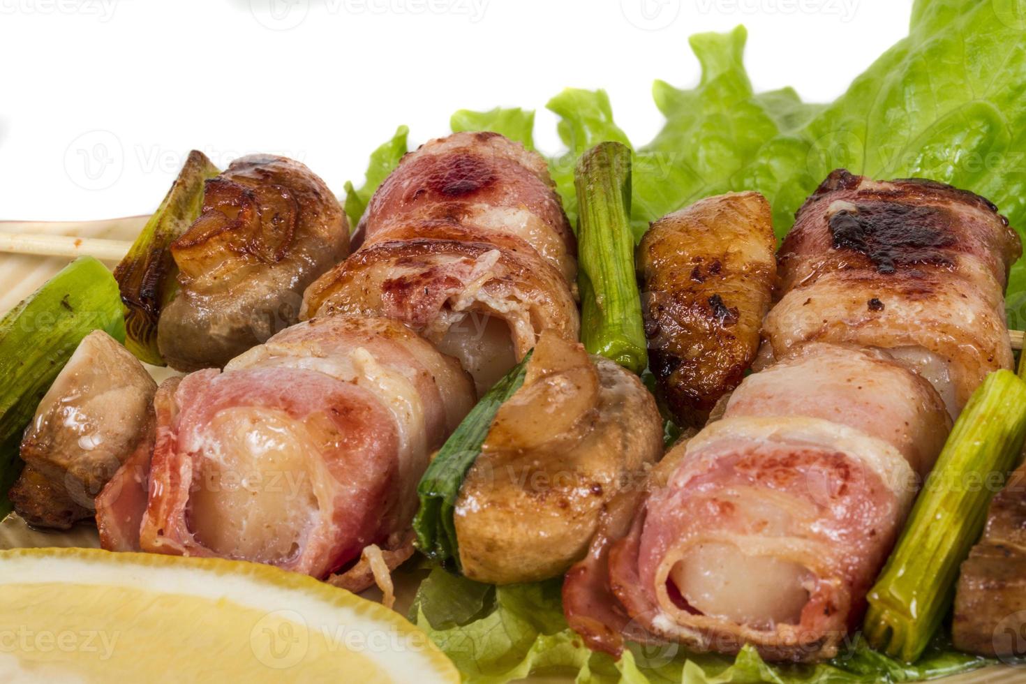 Bacon wrapped grilled Scallops with mushrooms and bacon photo
