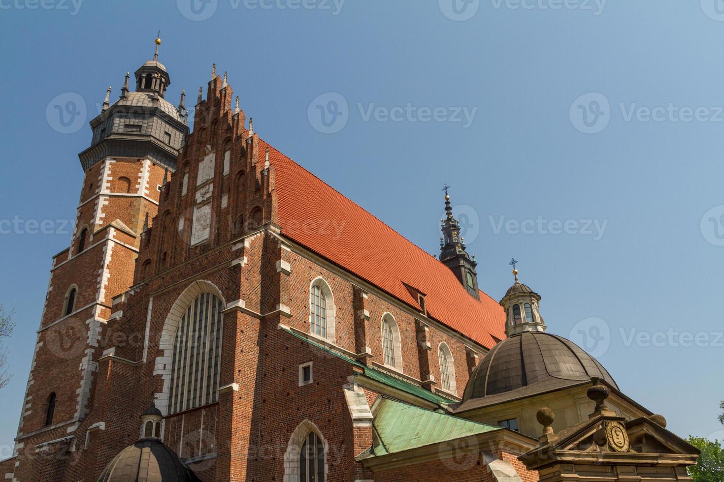 Cracow - Corpus Christi Church was founded by Kasimirus III The Great about 1340. The front elevation has a gothic gable whilst decoration of the interior is baroque photo
