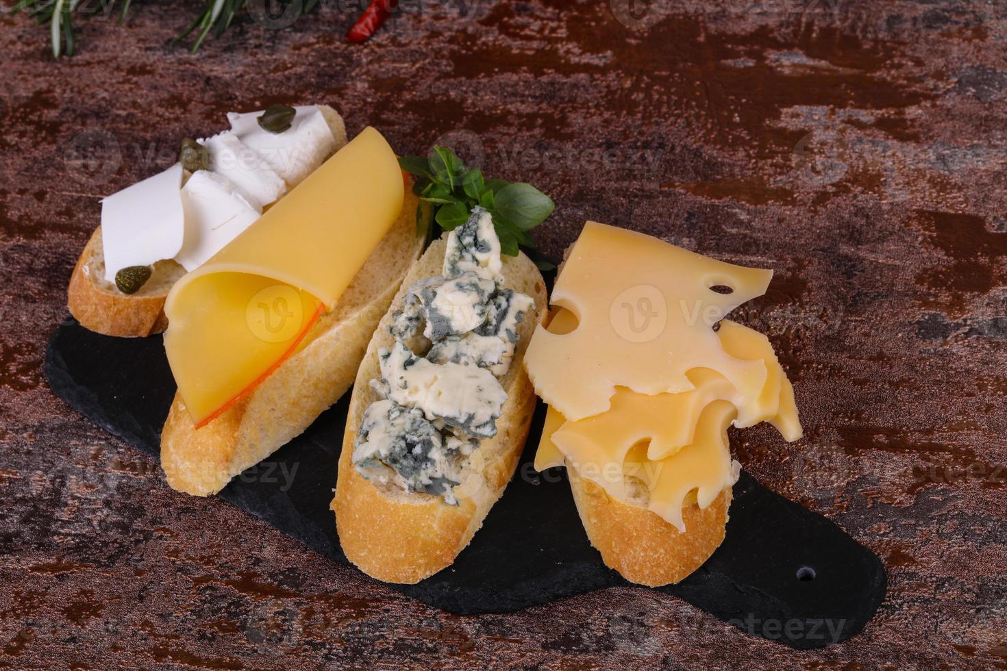 Bruschetta with various cheeses photo