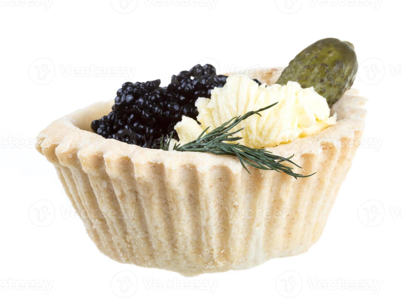 black caviar canape on white background photo