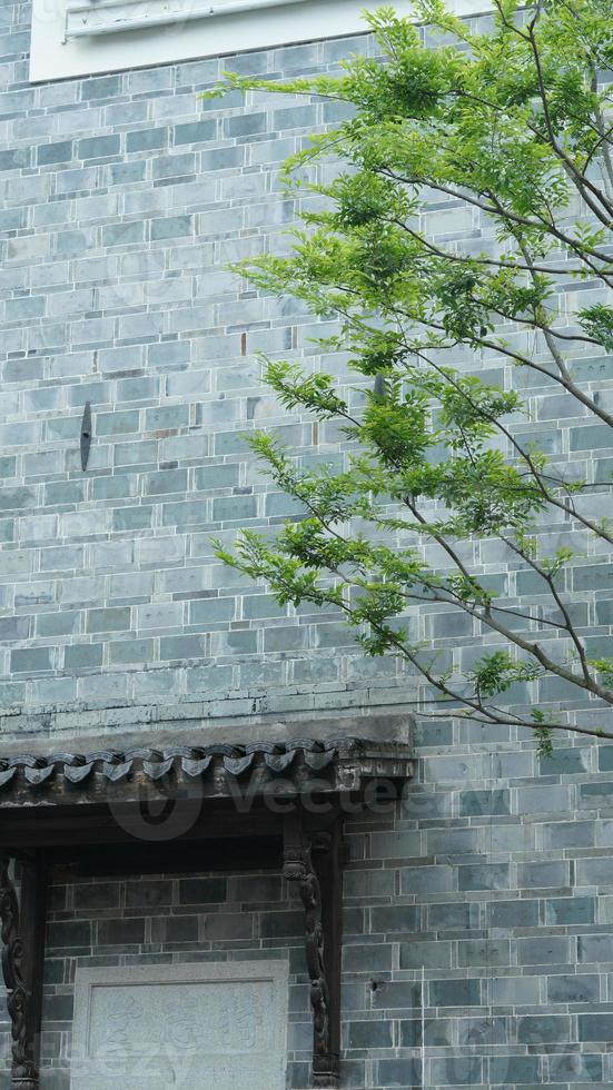 The old Chinese architectures made by the bricks and decorated with the brick sculpture photo