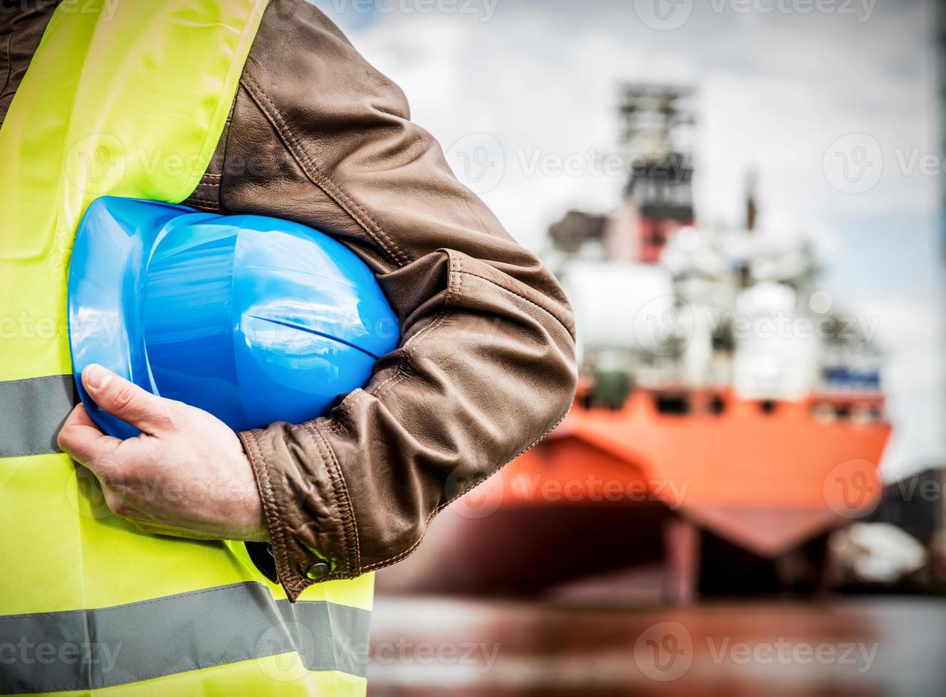 Shipbuilding engineer with safety helmet in shipyard photo