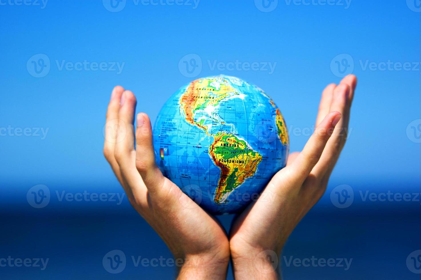 Earth globe in hands. Conceptual image photo
