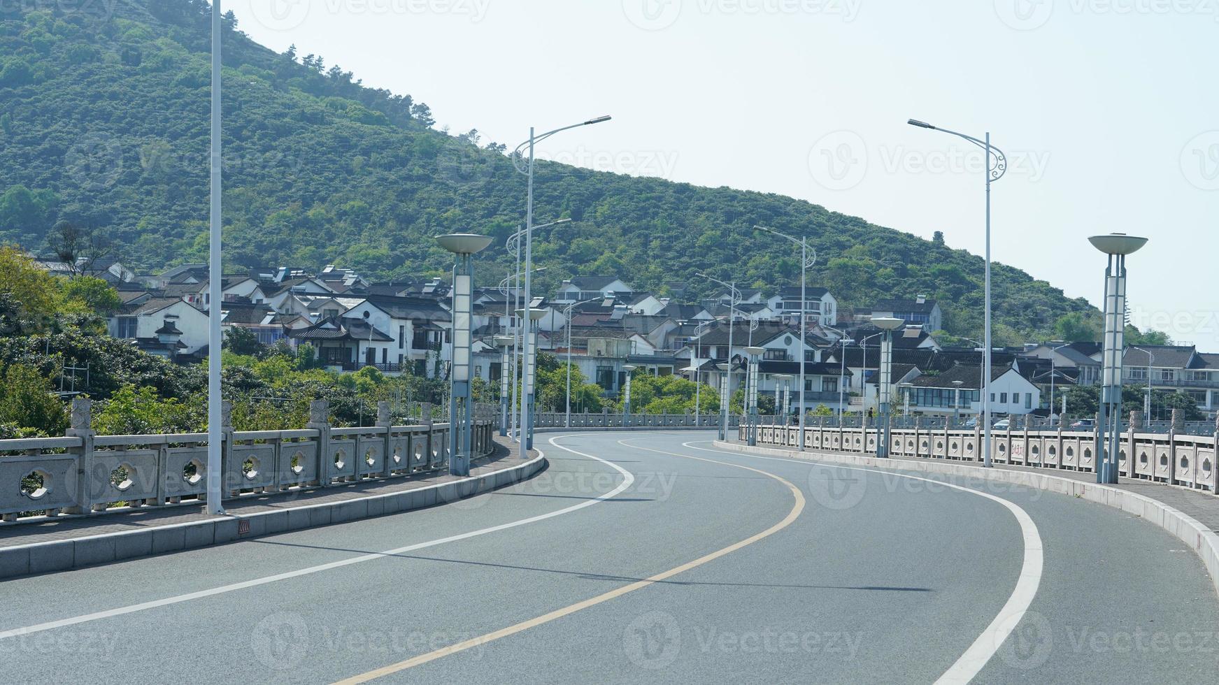 The beautiful Chinese countryside village view with  the old traditional buildings surrounded by the natural environment photo