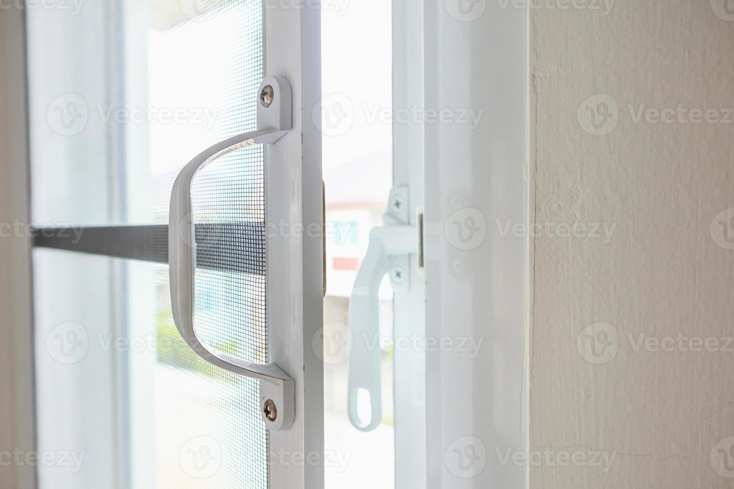 mosquito net wire screen on house window protection against insect photo