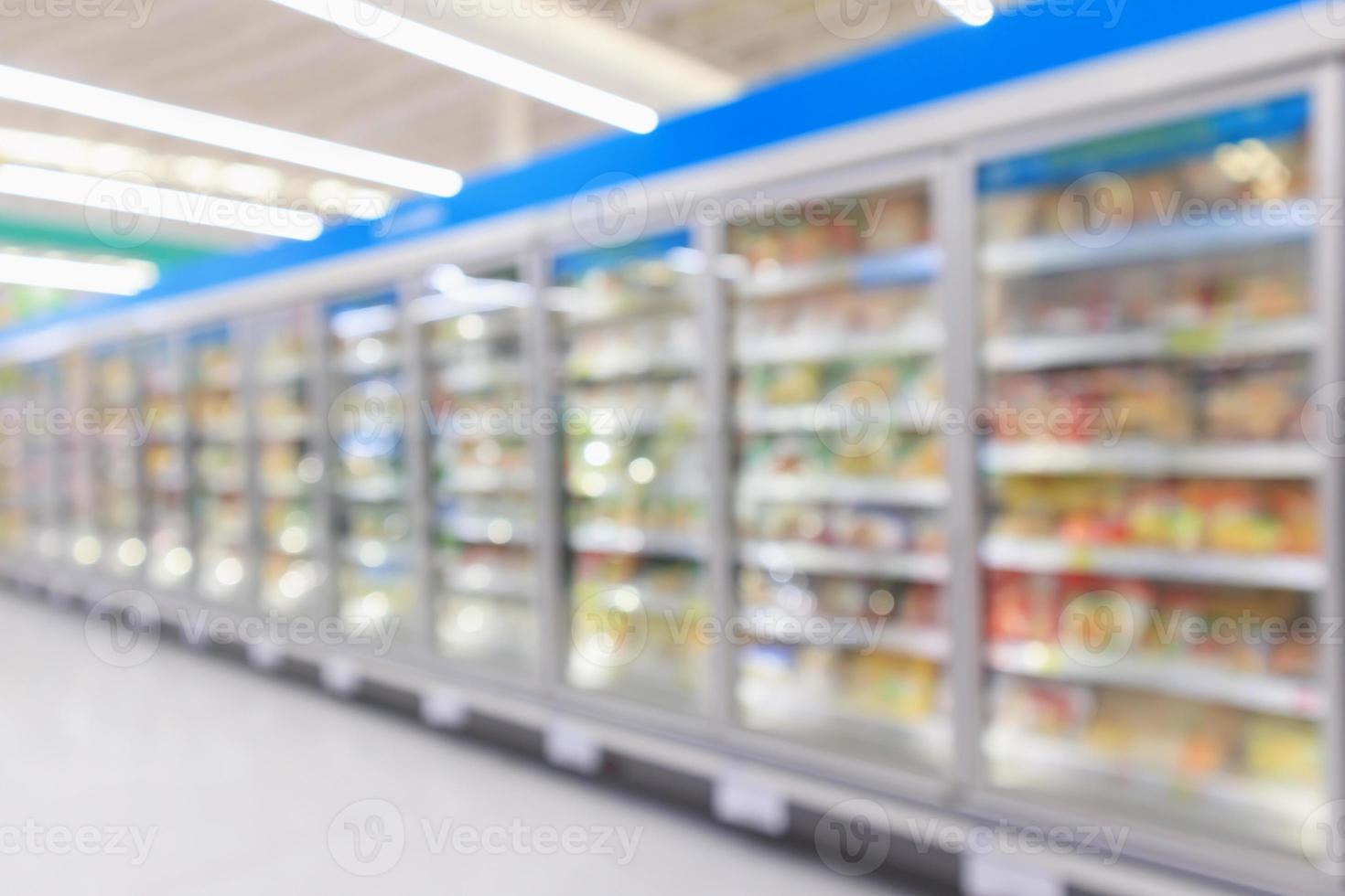 supermarket commercial refrigerators freezer showing frozen foods abstract blur background photo