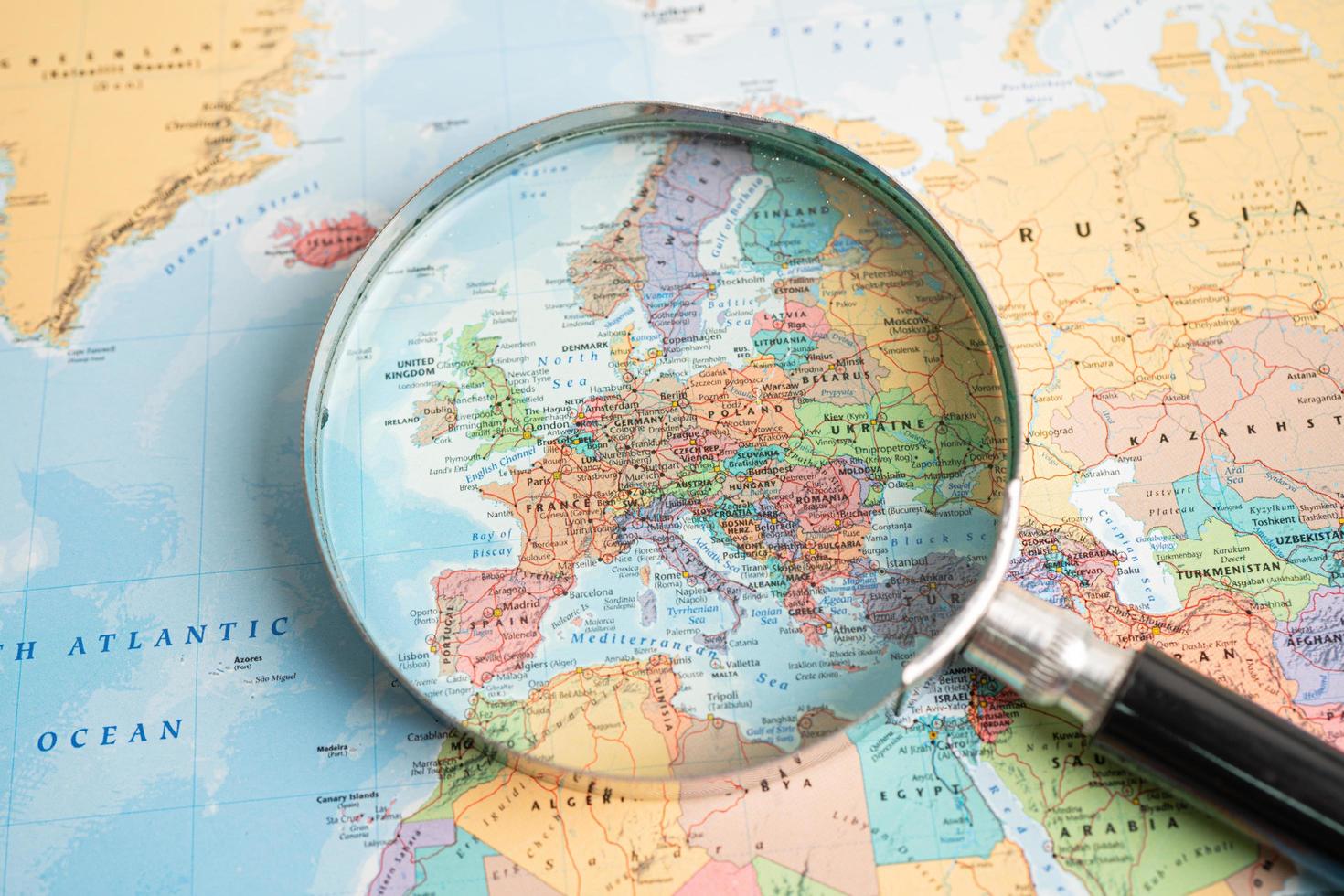 Bangkok, Thailand - May 01, 2022 China, Magnifying glass close up with colorful world map photo