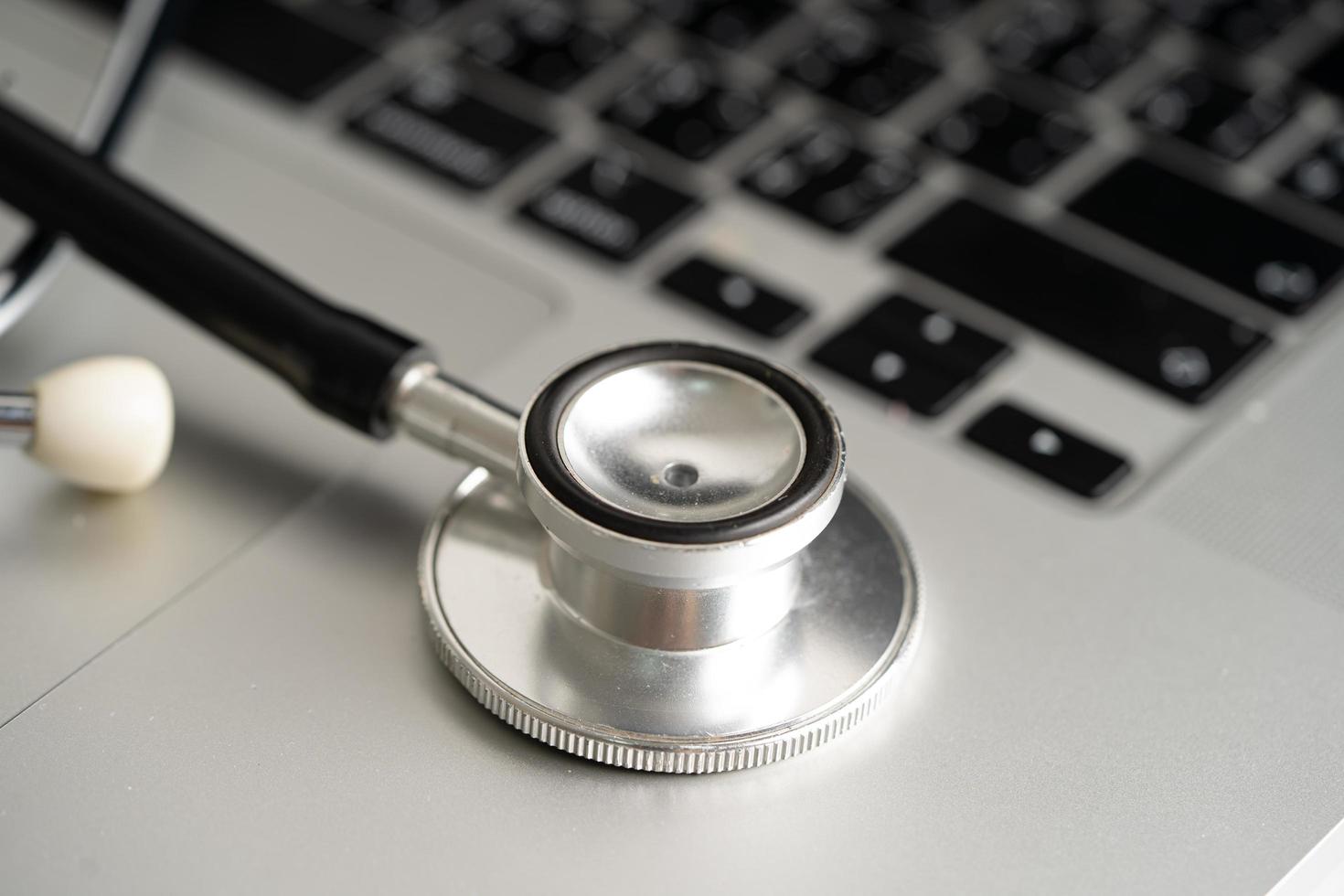 Stethoscope on laptop computer keyboard, Medical health concept. photo