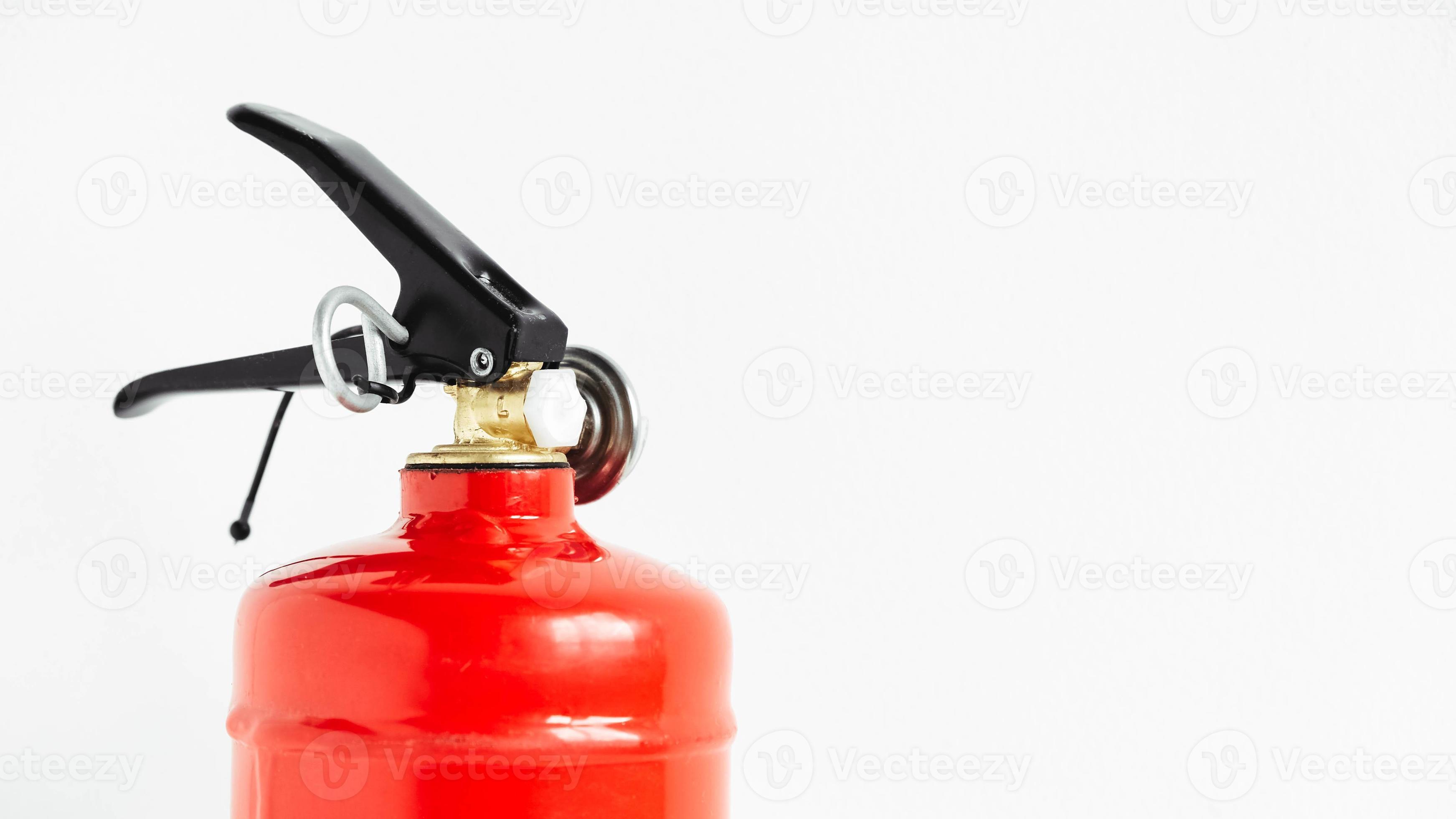 Red fire extinguisher on a white wall background 8509598 Stock Photo at